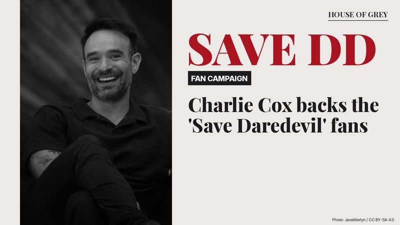 Charlie Cox smiling on stage at MCM Birmingham Comic Con, with the words 'SAVE DAREDEVIL'