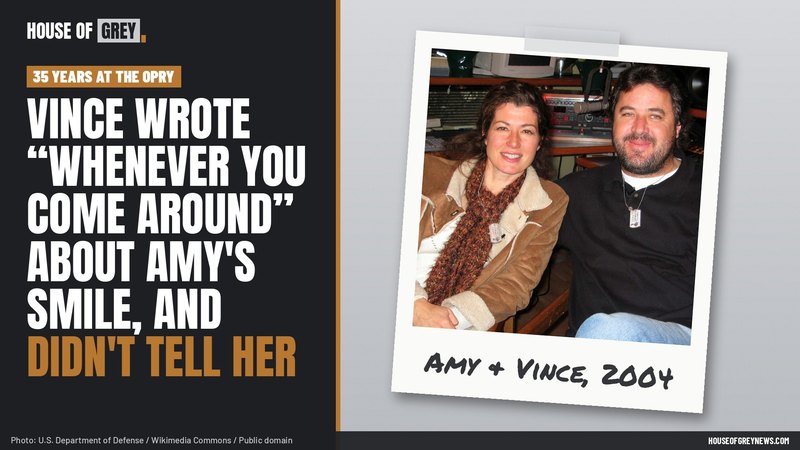 Amy Grant and Vince Gill sitting side by side and smiling in December 2004