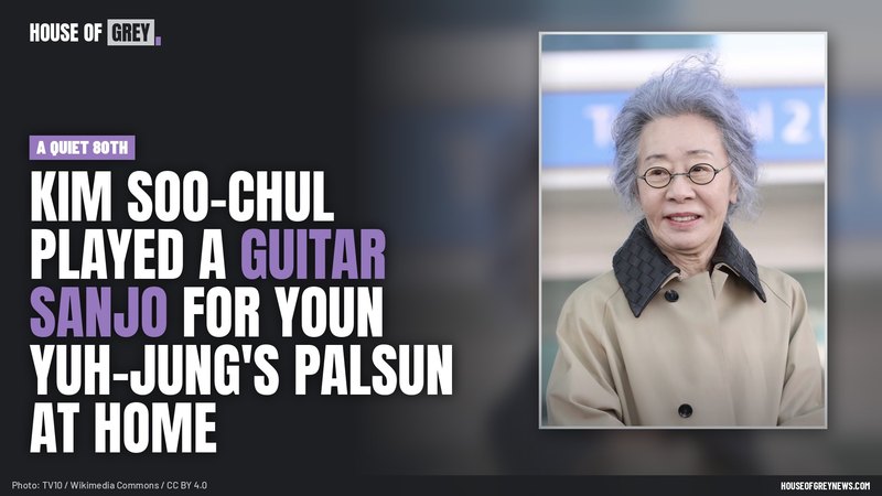 Youn Yuh-jung smiling in round glasses and a beige coat at an airport in February 2026