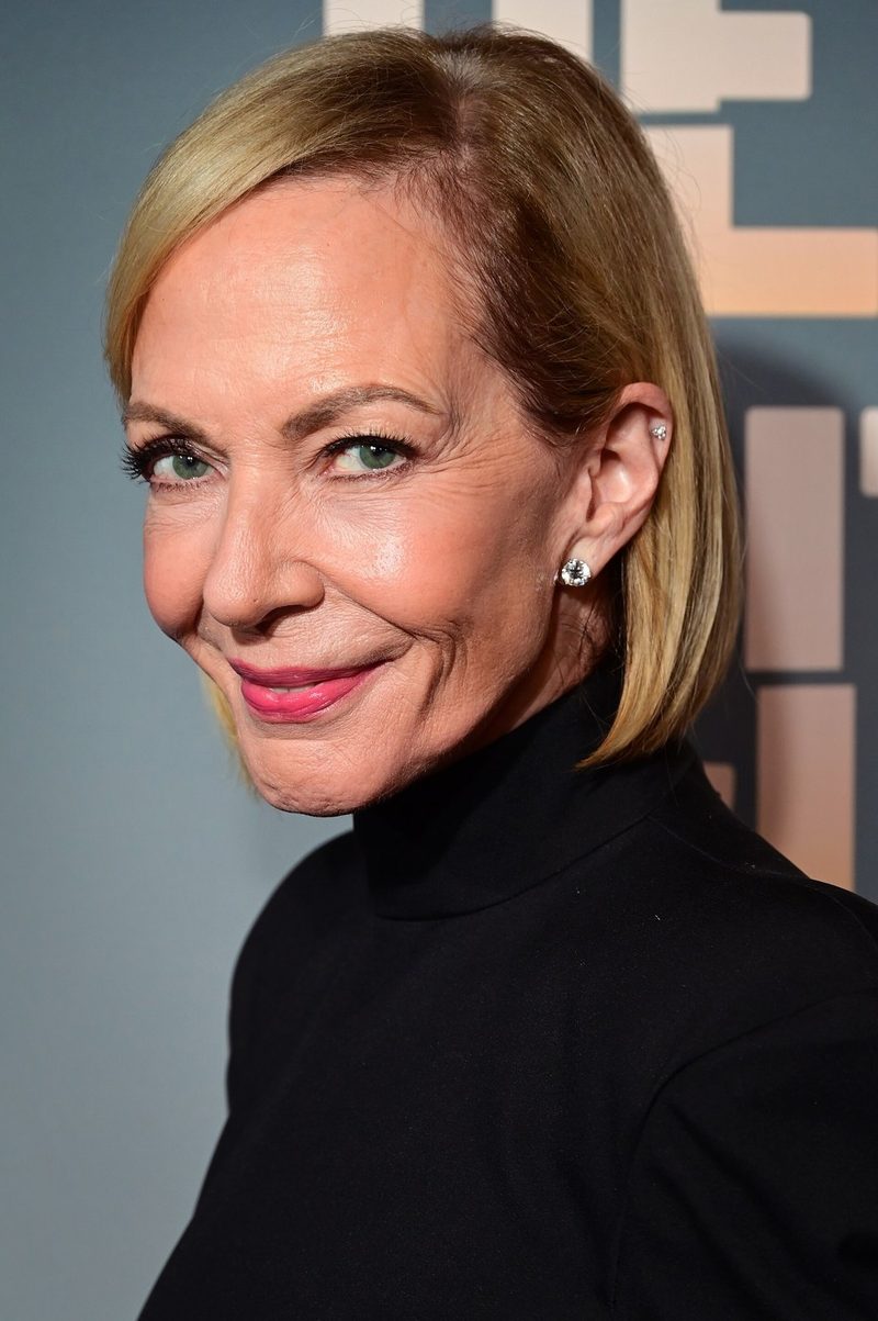 Allison Janney with a blonde bob and a black turtleneck in front of an Other Desert Cities backdrop