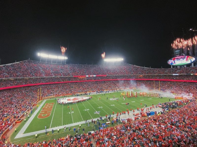 Packed Arrowhead Stadium seen from the stands during a night game