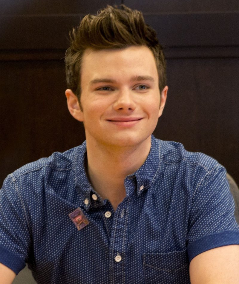 Chris Colfer smiling at a Land of Stories book signing at The Grove, Los Angeles, August 2013